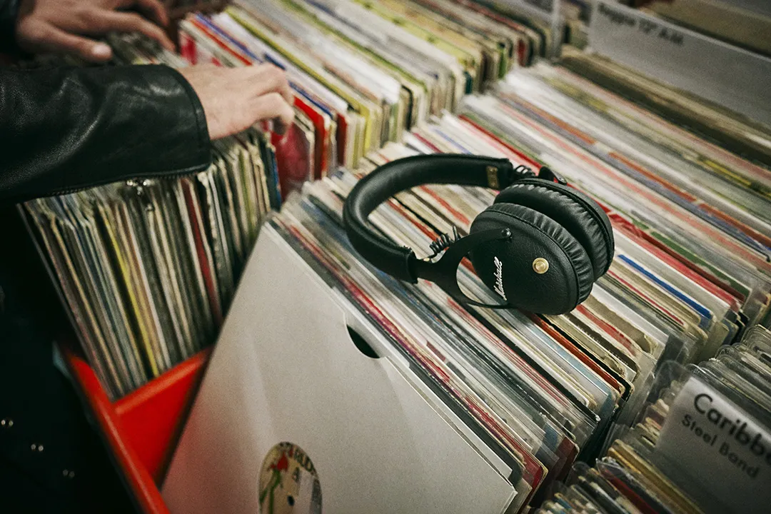 Marshall Monitor II black bluetooth headphones resting on vinyl crate