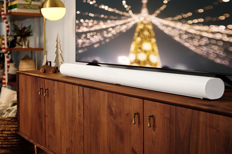 Sonos Arc in white on credenza under tv lifestyle image