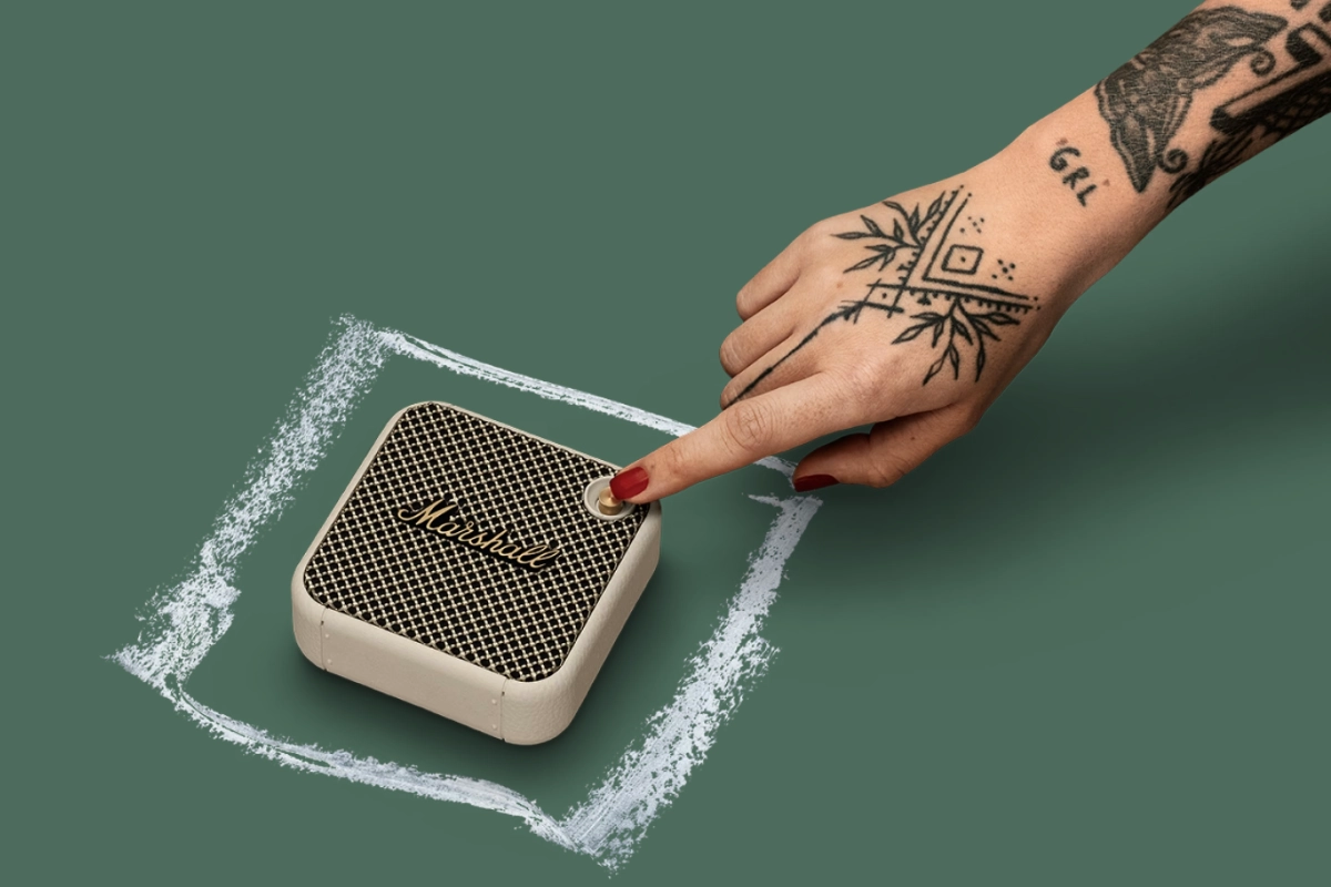 A retro-inspired Marshall Willen Bluetooth speaker, reminiscent of the vibrant style of the 1980s, showcasing classic design elements.