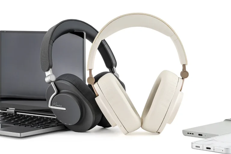 Moondrop Edge Headphones grey and cream on desk beside laptop