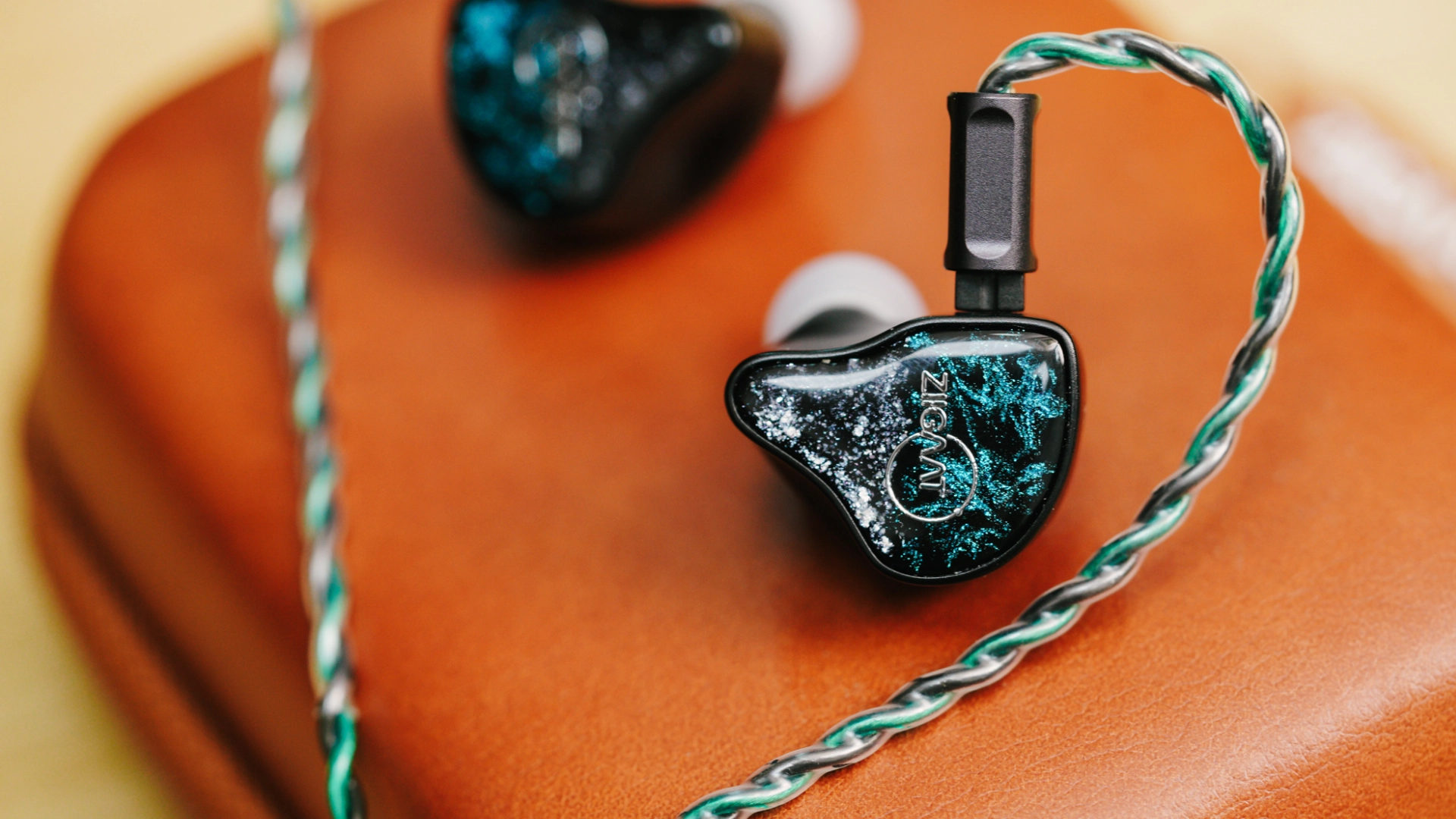 ZiiGaat x hangout audio Odyssey 2 IEM resting on orange case